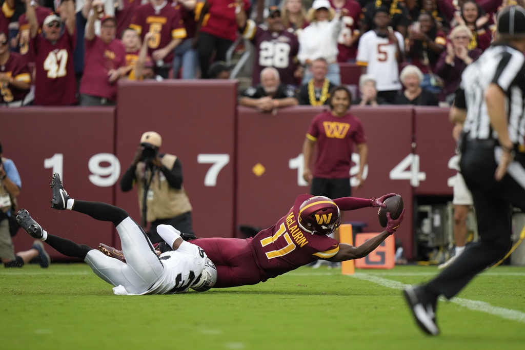 Washington Commanders wide receiver Terry McLaurin (17) is brought down by Las Vegas Raiders cornerback Kyu Blu Kelly (36) during the second half of NFL football game Sunday, Sept. 21, 2025, in Landover, Md. (AP Photo/Stephanie Scarbrough)