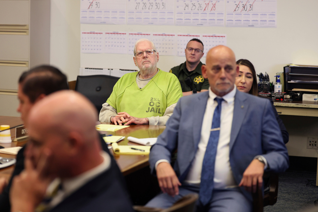 Orange County Superior Court Judge Jeffrey Ferguson reacts as he listens to victim impact statements while appearing for sentencing after his second-degree murder conviction for shooting his wife, at the Central Justice Center in Santa Ana, Calif., Wednesday, Sept. 17, 2025. (Allen J. Schaben/Los Angeles Times via AP, Pool)