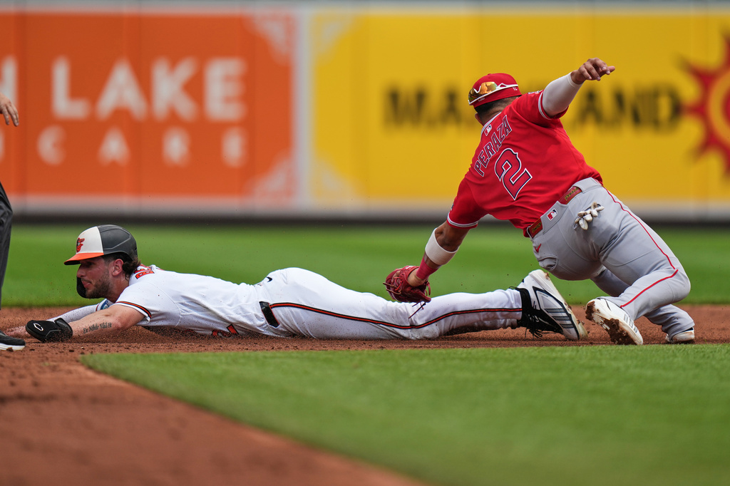 Baltimore Orioles' Dylan Beavers, left, is caught stealing second base by Los Angeles Angels second baseman Oswald Peraza (2) during the third inning of a baseball game, Thursday, Aug. 6, 2026, in Baltimore. (AP Photo/Stephanie Scarbrough)