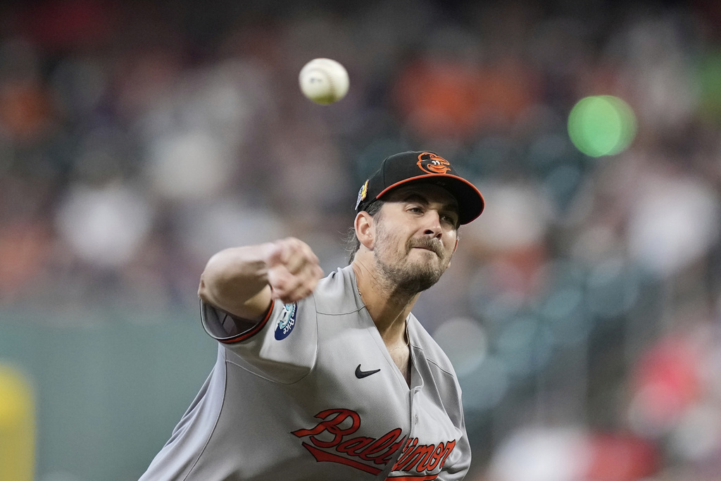 Baltimore Orioles starting pitcher Dean Kremer throws against the Houston Astros during the first inning of a baseball game Sunday, Aug. 17, 2025, in Houston. (AP Photo/David J. Phillip)