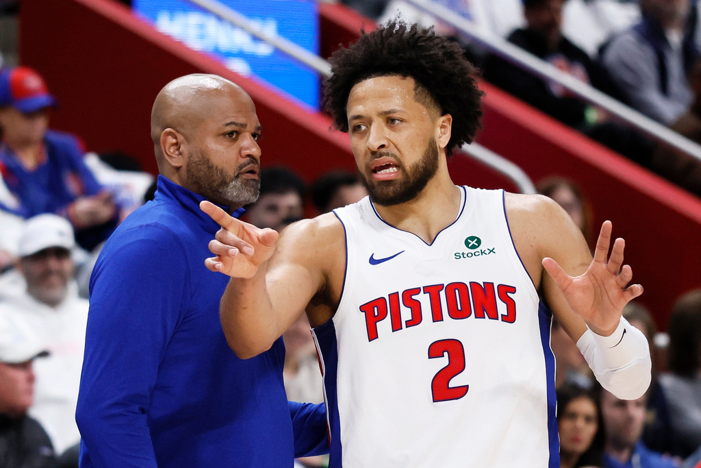 Detroit Pistons guard Cade Cunningham (2) discusses a play with Detroit Pistons head coach J.B. Bickerstaff, left, during the first half in Game 1 against the Orlando Magic in a first-round NBA basketball playoffs series Sunday, April 19, 2026, in Detroit. (AP Photo/Duane Burleson)
