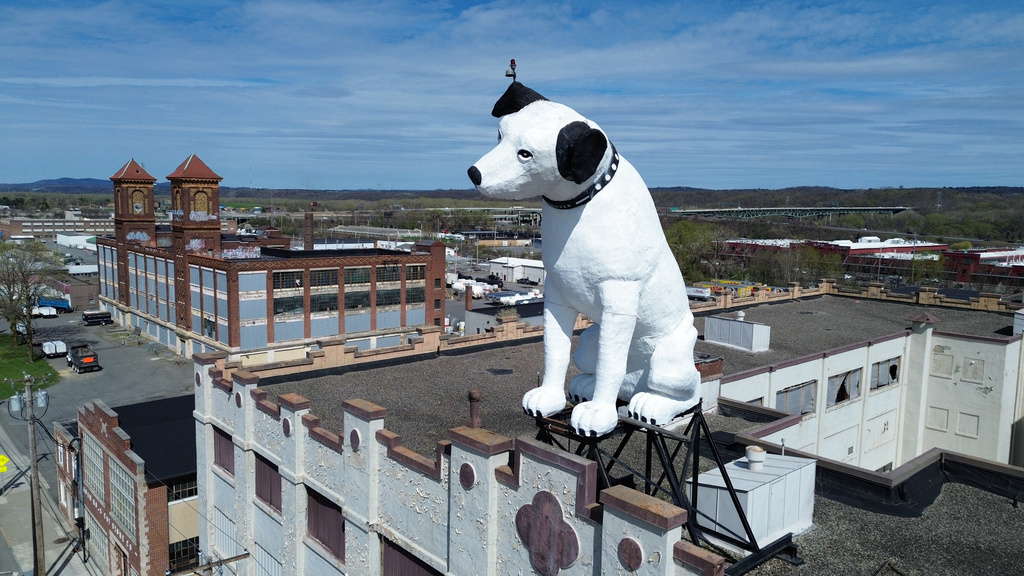 A giant statue of Nipper the dog sits atop a building in the warehouse district in Albany, N.Y., Tuesday, April 21, 2026. (AP Photo/Ted Shaffrey)