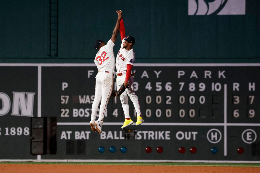 Boston Red Sox's Andruw Monasterio (32) celebrates with teammate Ceddanne Rafaela after defeating the Washington Nationals in a baseball game, Monday, June 29, 2026, in Boston. (AP Photo/Mary Schwalm)