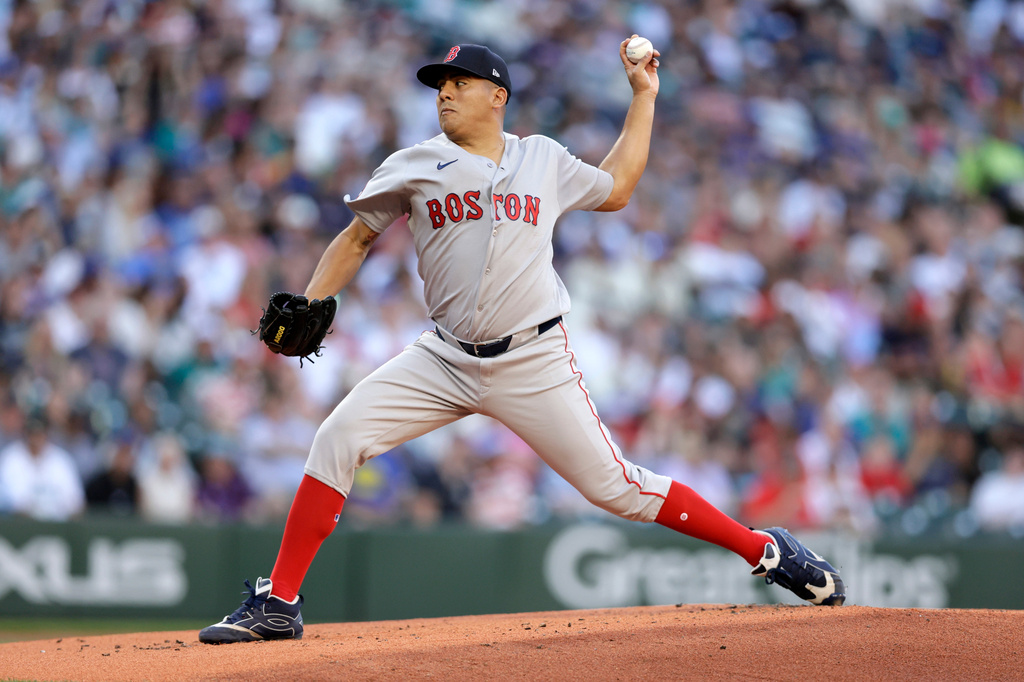 Boston Red Sox starting pitcher Ranger Suarez throws against the Seattle Mariners during the first inning of during a baseball game, Friday, June 19, 2026, in Seattle. (AP Photo/John Froschauer)