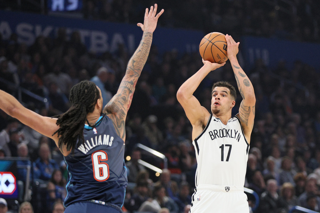 Brooklyn Nets forward Michael Porter Jr. (17) looks to shoot over Oklahoma City Thunder forward Jaylin Williams (6) during the first half of an NBA basketball game Friday, Feb. 20, 2026, in Oklahoma City. (AP Photo/Nate Billings)