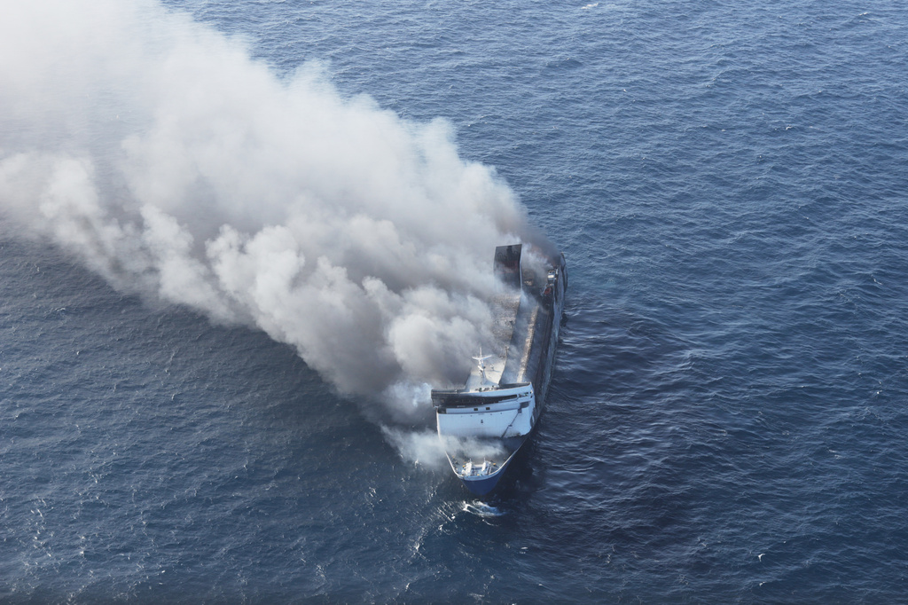 Smoke billows from passenger ship Mutiara Santosa 2 after it caught fire in the waters off Madura Island, Indonesia, Sunday, Aug. 2, 2026. (AP Photo)