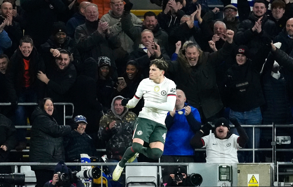 Chelsea's Alejandro Garnacho, left, scores their third goal of the game against Cardiff City during the English League Cup quarterfinal soccer match in Cardiff, Tuesday, Dec. 16, 2025. (Nick Potts/PA via AP)