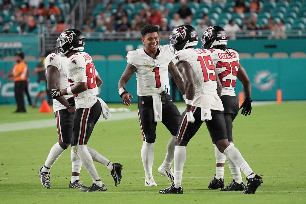Atlanta Falcons quarterback Tua Tagovailoa (1) celebrates with teammates during the first half of an NFL preseason football game against the Miami Dolphins, Friday, Aug. 28, 2026, in Miami Gardens, Fla. (AP Photo/Lynne Sladky)