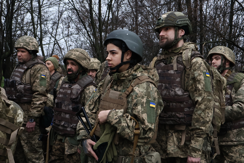In this photo provided by Ukraine's 65th Mechanized Brigade press service, recruits attend drills at a training ground in the Zaporizhzhia region, Ukraine, Friday, Dec. 12, 2025. (Andriy Andriyenko/Ukraine's 65th Mechanized Brigade via AP)