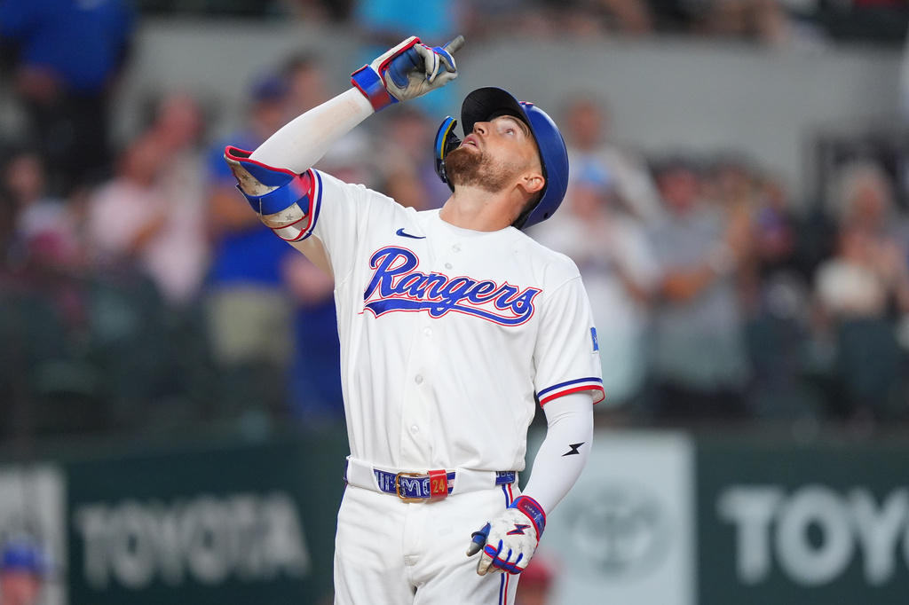 Texas Rangers' Brandon Nimmo celebrates his home run during the first inning of a baseball game against the Chicago White Sox, Tuesday, July 21, 2026, in Arlington, Texas. (AP Photo/LM Otero)