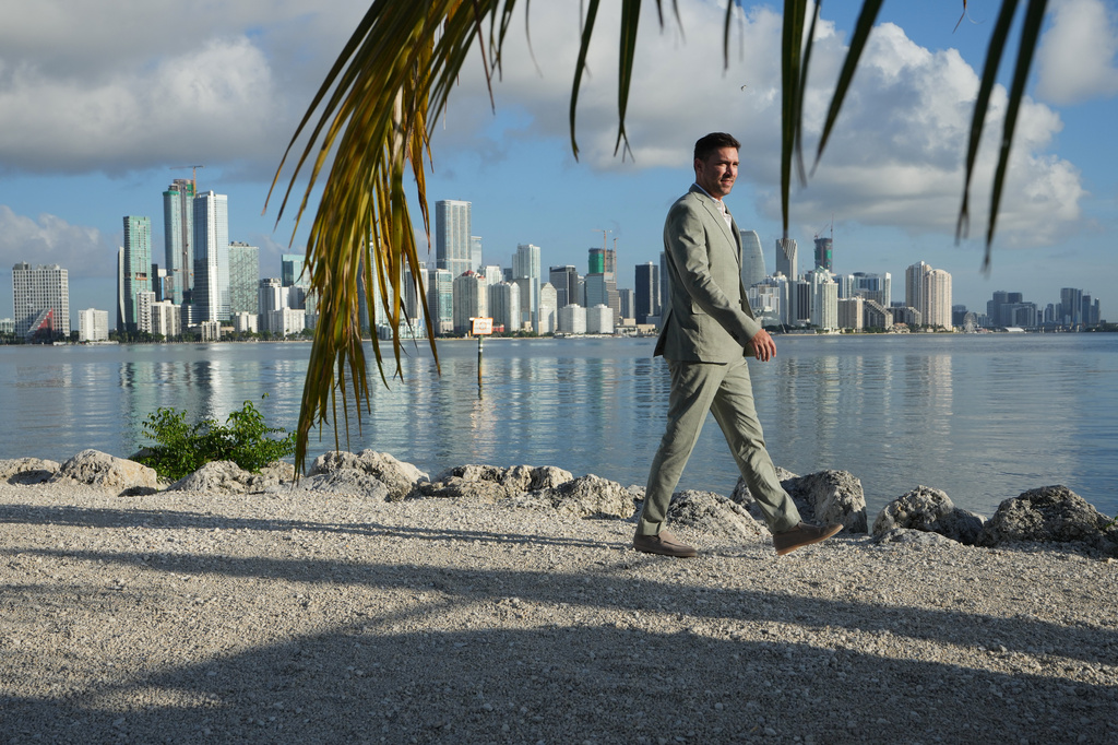 Aaron DeMayo, founder of Future Vision Studios, walks along Biscayne Bay, Wednesday, Aug. 12, 2026, in Miami. (AP Photo/Lynne Sladky)