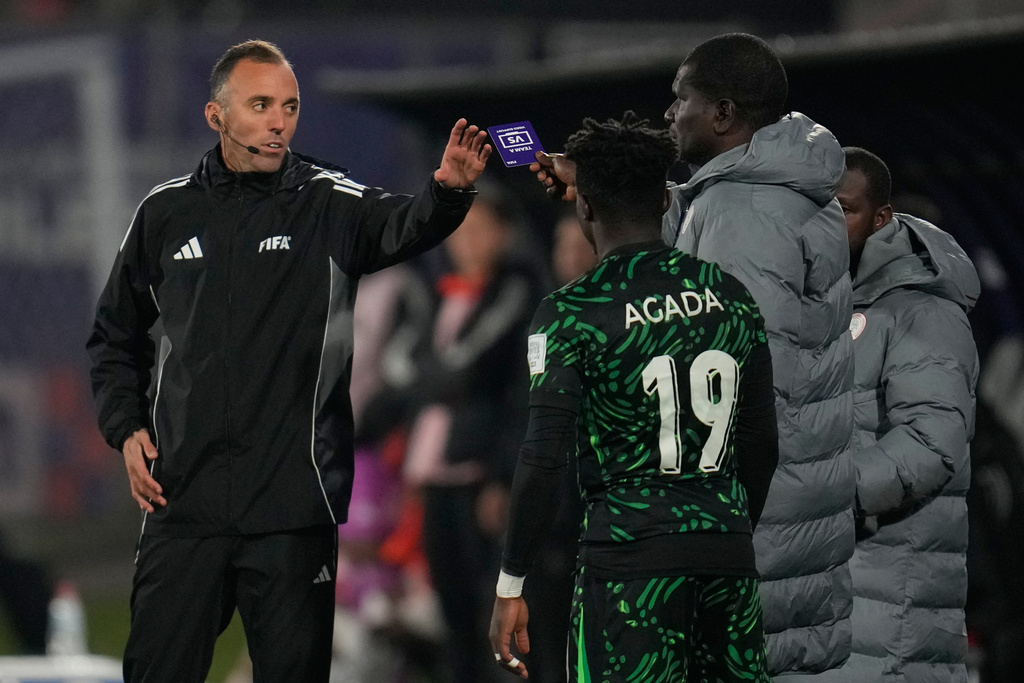 Nigeria's coach Aliyu Zubair asks for a VAR review to referee Joao Pinheiro, of Portugal, during a FIFA U-20 World Cup Group F soccer match against Colombia at Fiscal Stadium in Talca, Chile, Sunday, Oct. 5, 2025. (AP Photo/Matias Delacroix)