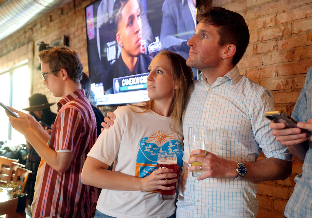 Nate Blouin watches the results roll in with his wife, Jackie Rosen, at his primary election watch party at Kiitos Brewing in Salt Lake City, Utah on Tuesday, June 23, 2026. (Kristin Murphy/The Deseret News via AP)
