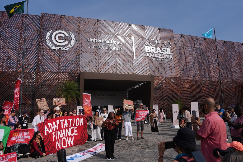 Activists participate in a demonstration for climate finance outside the COP30 U.N. Climate Summit venue, Thursday, Nov. 13, 2025, in Belem, Brazil. (AP Photo/Joshua A. Bickel)