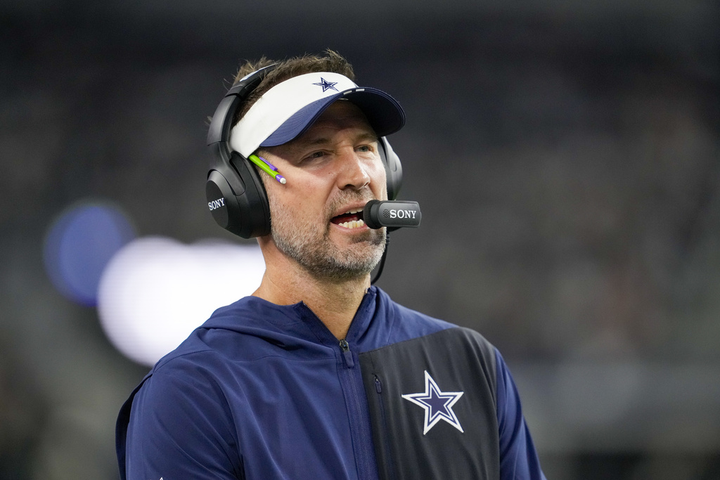 Dallas Cowboys head coach Brian Schottenheimer looks on during the second half of a preseason NFL football game against the Atlanta Falcons Friday, Aug. 22, 2025, in Arlington, Texas. (AP Photo/Tony Gutierrez)