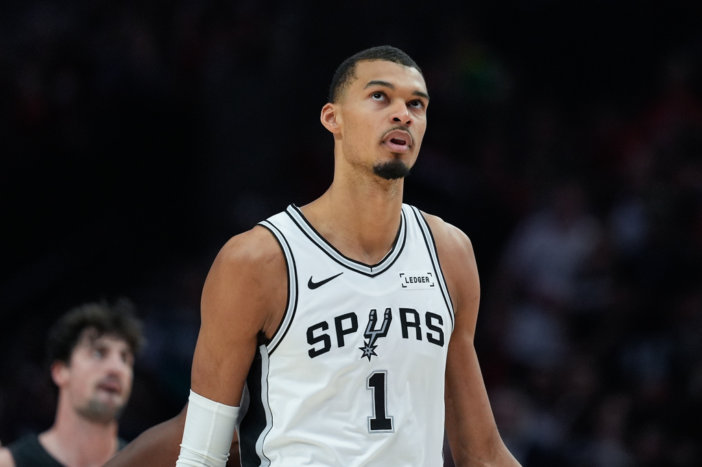 San Antonio Spurs forward/center Victor Wembanyama looks during the first half in Game 4 of a first-round NBA basketball playoffs series against the Portland Trail Blazers, in Portland, Ore., Sunday, April 26, 2026. (AP Photo/Jenny Kane)