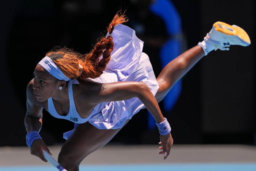 Coco Gauff of the U.S. serves to Kamilla Rakhimova of Uzbekistan during their first round match at the Australian Open tennis championship in Melbourne, Australia, Monday, Jan. 19, 2026. (AP Photo/Aaron Favila)