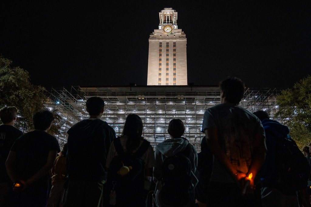 FILE - University of Texas students and community members gather for a candlelight vigil on the Main Mall to remember and pray for the victims, including University of Texas student Savitha Shan, of a mass shooting on West Sixth Street, in Austin, Texas, Wednesday, March 4, 2026. (Sara Diggins/Austin American-Statesman via AP, File)