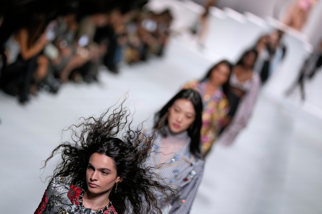 Models wear creations as part of the Dolce & Gabbana Spring/Summer 2026 collection presented in Milan, Italy, Saturday, Sept. 27, 2025. (AP Photo/Luca Bruno)