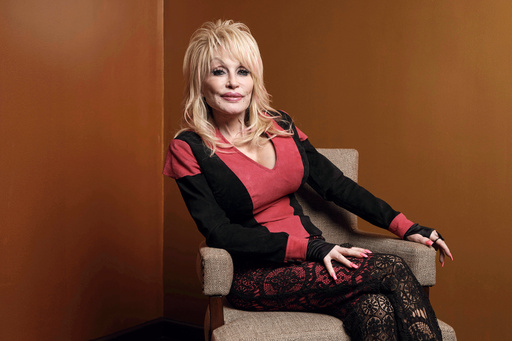 FILE - Dolly Parton poses at the Carnegie Medal of Philanthropy Ceremony in New York, on Oct. 13, 2022. (AP Photo/Andres Kudacki, File) FILE - Dolly Parton poses at the Carnegie Medal of Philanthropy Ceremony in New York, on Oct. 13, 2022. (AP Photo/Andres Kudacki, File)