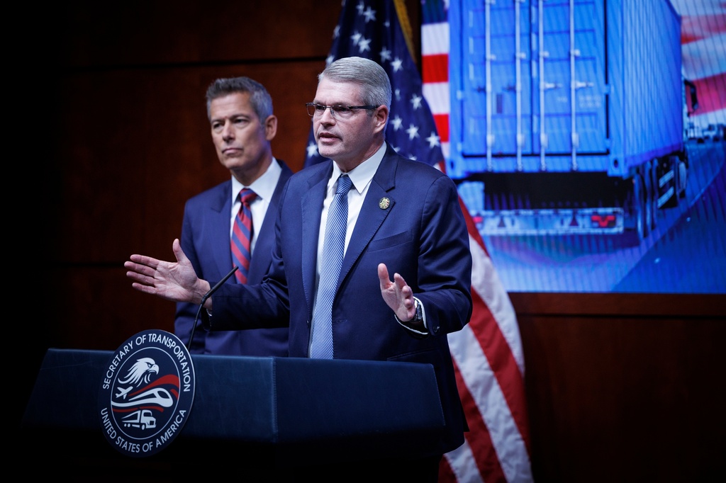 Federal Motor Carrier Safety Administrator Derek Barrs speaks beside U.S. Transportation Secretary Sean Duffy, left, during a news conference on enhancing truck driving safety at the U.S. Department of Transportation on Friday, Feb. 20, 2026, in Washington. (AP Photo/Tom Brenner)