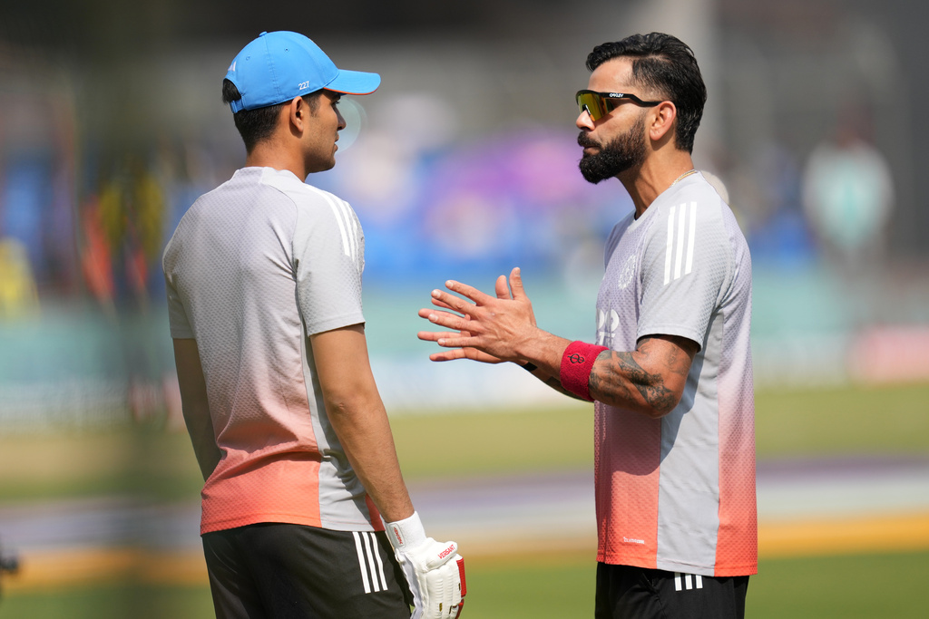 India's Virat Kohli, right, chats with captain Shubman Gill before the start of the third One Day International cricket match between India and New Zealand in Indore, India, Sunday, Jan. 18, 2026. (AP Photo/Rafiq Maqbool)