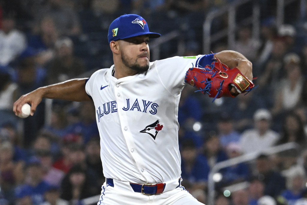 Toronto Blue Jays starting pitcher Jose Berrios throws to a Texas Rangers batter in first-inning baseball game action in Toronto, Sunday, Aug. 17, 2025. (Jon Blacker/The Canadian Press via AP)
