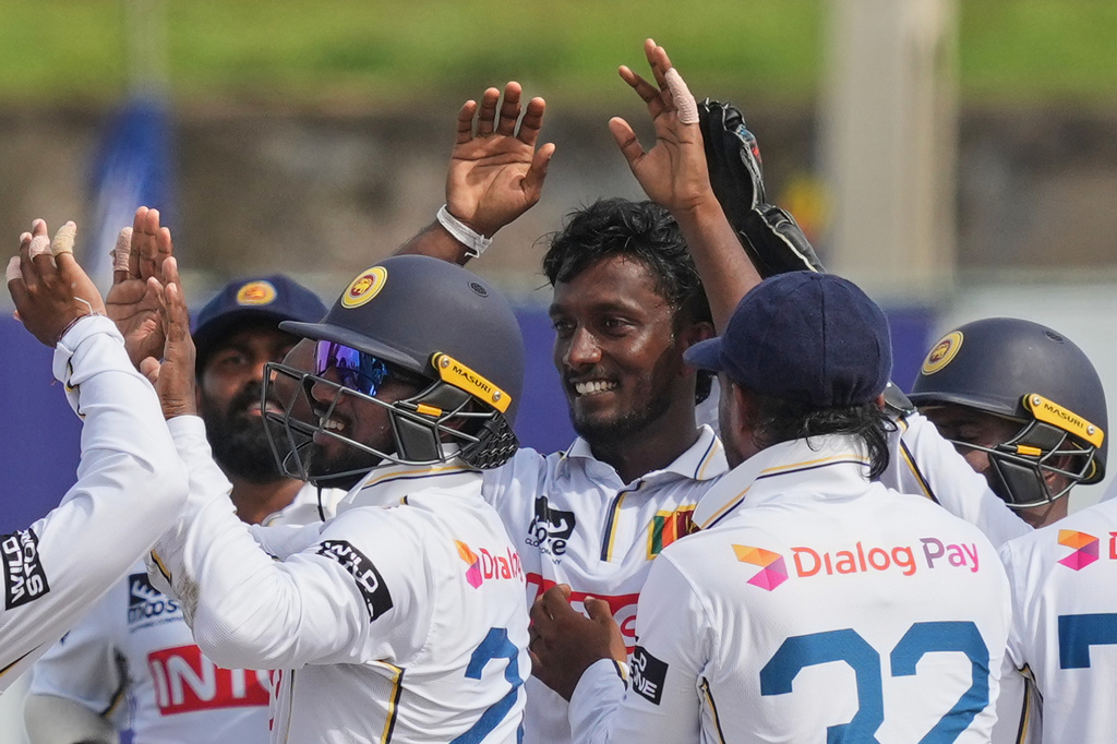 Sri Lanka's Keshara Nuwantha, center, celebrates the dismissal of India's KL Rahul with teammates during the second day of the first Test cricket match between Sri Lanka and India in Galle, Sri Lanka, Sunday, Aug. 16, 2026. (AP Photo/Eranga Jayawardena)