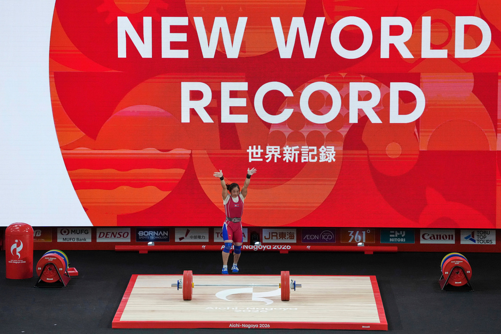 North Korea's Oh Kwang Ok reacts after a successful lift during the women's 57kg weightlifting final at the Asian Games in Nagoya, Japan, Friday, Sept. 25, 2026. (AP Photo/Aaron Favila)
