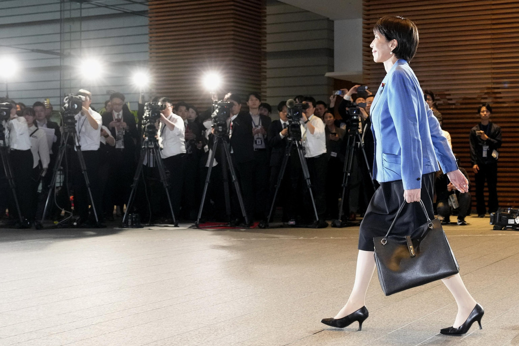 Japanese Prime Minister Sanae Takaichi arrives at the prime minister's office in Tokyo on Oct. 21, 2025. (Kyodo News via AP)