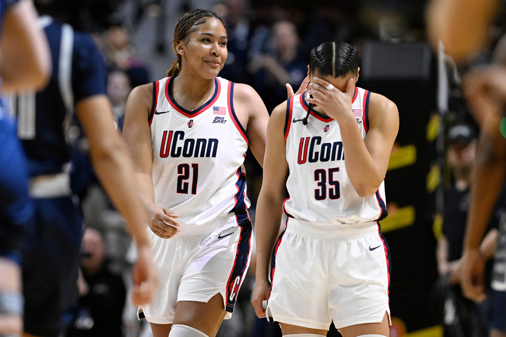 UConn forward Sarah Strong (21) and guard Azzi Fudd (35) share a light moment during first half of an NCAA college basketball game against Georgetown in the quarterfinals of the Big East tournament, Saturday, March 7, 2026, in Uncasville, Conn. (AP Photo/Jessica Hill)