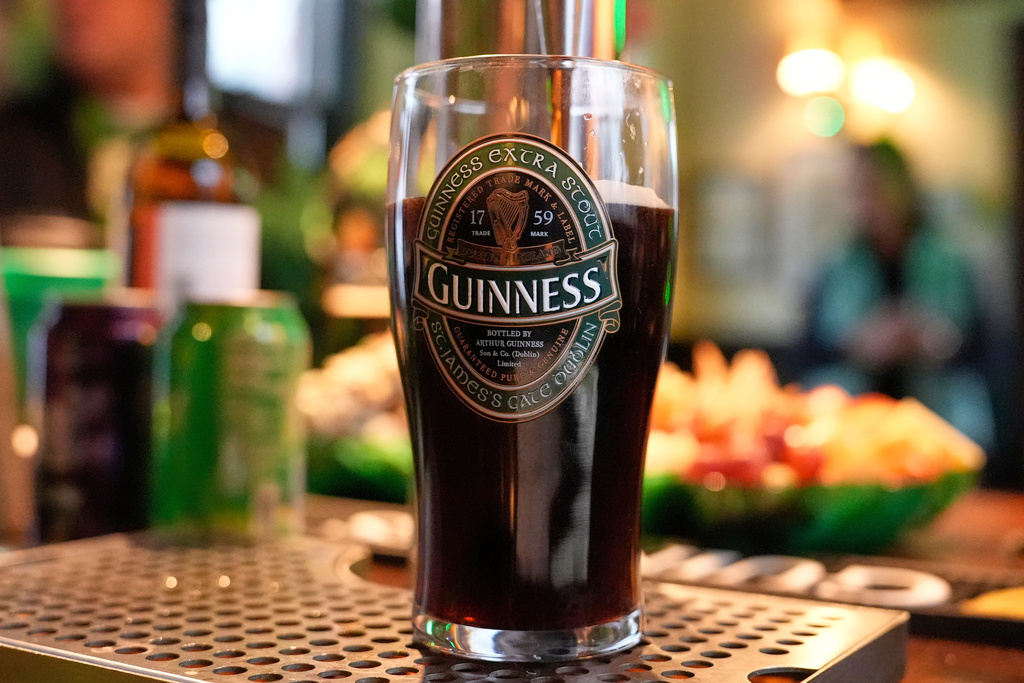 A pint of Guinness is poured at an early St. Patrick's Day party in a tiny pub, Friday, March 13, 2026, in Andover, Mass. (AP Photo/Robert F. Bukaty)