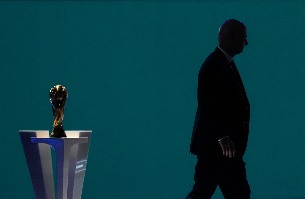 FILE - FIFA President Gianni Infantino is silhouetted as he walks past the World Cup trophy after addressing the 76th FIFA Congress in Vancouver, British Columbia, Thursday, April 30, 2026. (Darryl Dyck/The Canadian Press via AP, File)