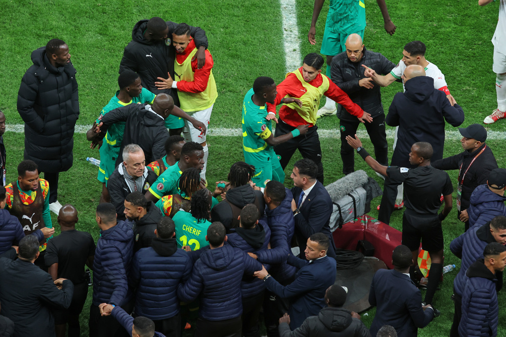 FILE - Players from both sides clash after a controversial penalty was awarded to Morocco late on during the Africa Cup of Nations final soccer match between Senegal and Morocco in Rabat, Morocco, Sunday, Jan. 18, 2026. (AP Photo/Youssef Loulidi, File)