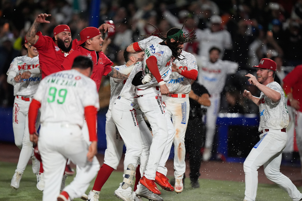 Mexico Red players celebrate after beating Mexico Green during the Caribbean Series baseball championship game in Guadalajara, Mexico, Saturday, Feb. 7, 2026. (AP Photo/Fernando Llano)