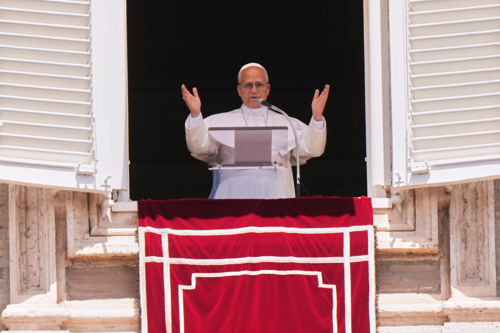 Pope Leo XIV delivers his blessing as he recites the Regina Coeli noon prayer from the window of his studio overlooking St. Peter's Square, at the Vatican, Sunday, May 17, 2026. (AP Photo/Andrew Medichini)