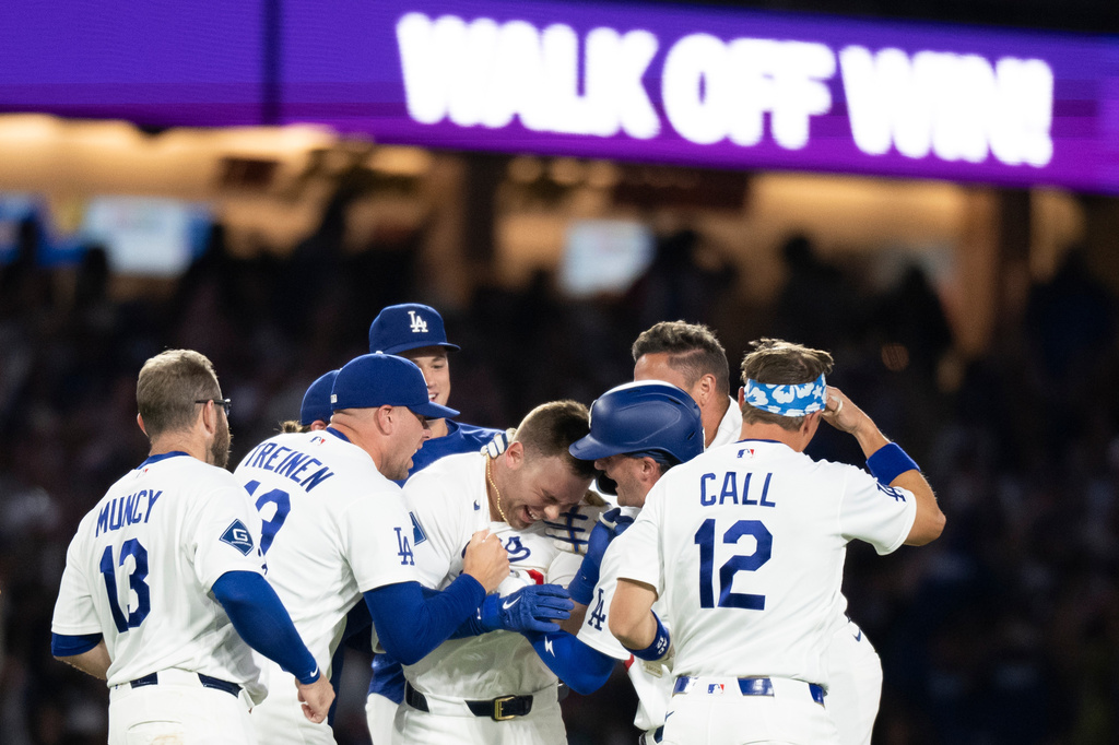 Los Angeles Dodgers players celebrate a walk-off single by Dalton Rushing in a baseball game against the Baltimore Orioles in Los Angeles, Friday, June 19, 2026. (AP Photo/Kyusung Gong)
