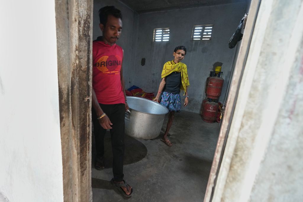 Migrant workers prepare to cook at their deserted quarters at a ceramics factory in Morbi, in the Indian state of Gujarat, Wednesday, April 8, 2026. (AP Photo/Ajit Solanki)