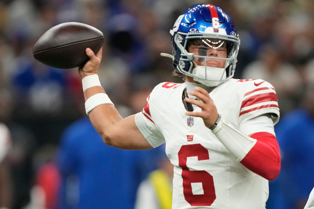 New York Giants quarterback Jaxson Dart (6) works in the pocket against the New Orleans Saints in the first half of an NFL football game, Sunday, Oct. 5, 2025, in New Orleans. (AP Photo/Gerald Herbert)