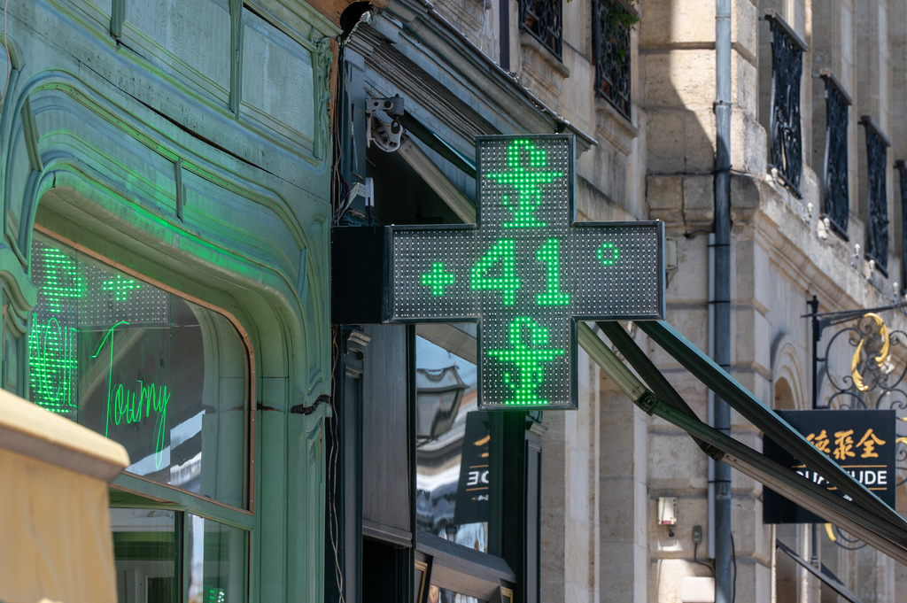 A drugstore sign shows the temperature of 41 degrees Celsius (105,8 degrees Fahrenheit) in Bordeaux, southwestern France, on Tuesday, June 23, 2026, as the national weather service, Meteo France, placed 54 departments, about half the country, under a red heat wave alert. (AP Photo/Caroline Blumberg)