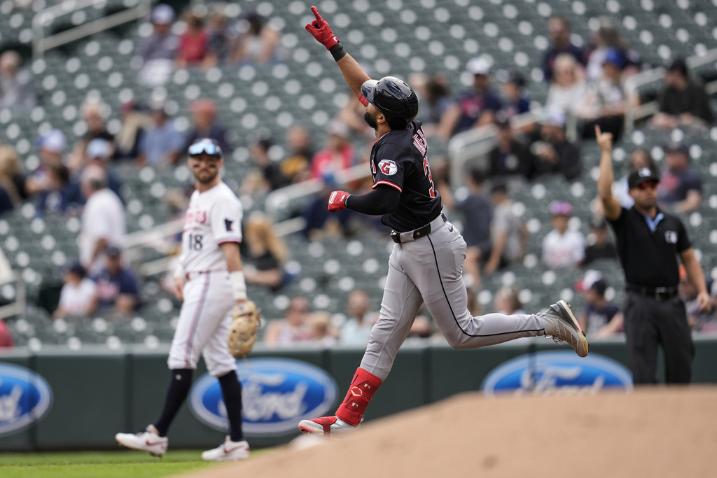 Cleveland Guardians' George Valera (35) celebrates a solo home run against the Minnesota Twins in the second inning of a baseball game, Saturday, Sept. 20, 2025, in Minneapolis. (AP Photo/Mike Stewart)