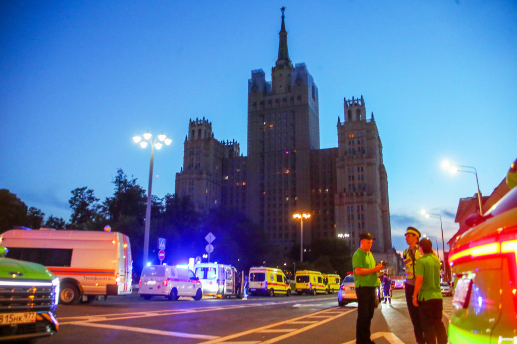 Emergency vehicles are parked in an area near a deadly explosion at a restaurant in Moscow, Saturday, Aug. 1, 2026. (Sergei Vedyashkin/Moscow News Agency via AP)