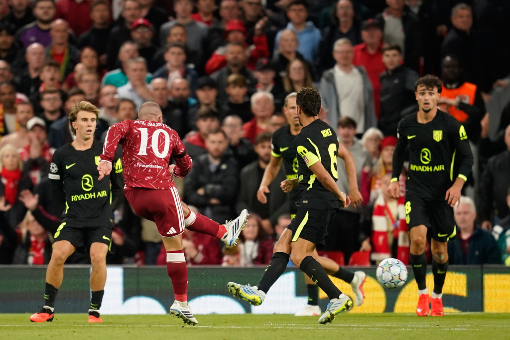 Liverpool's Alexis Mac Allister scores his side's second goal during the Champions League opening phase soccer match between Liverpool and Atletico Madrid in Liverpool, England, Wednesday, Sept. 9, 2026. (AP Photo/Dave Thompson)