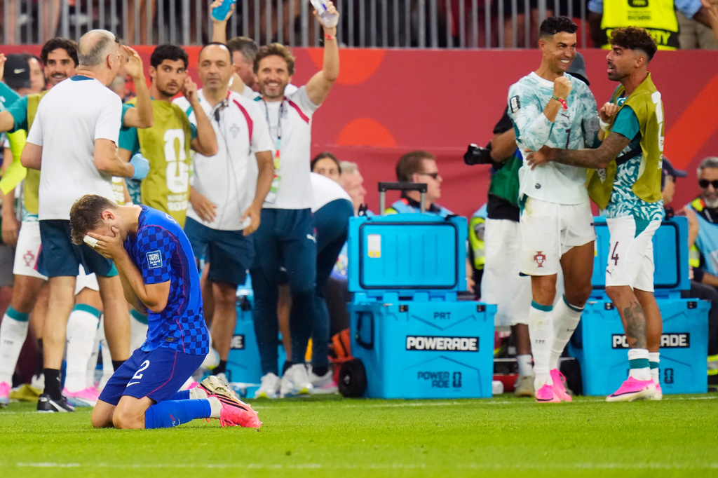 Croatia's Josip Stanisic (2) reacts as a goal is disallowed as Portugal's Cristiano Ronaldo, second right, celebrates during the second half of a World Cup round of 32 soccer match, in Toronto on Thursday, July 2, 2026. (Chris Young/The Canadian Press via AP)
