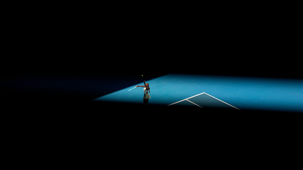 Coco Gauff of the U.S. serves to Paula Badosa of Spain during their quarterfinal match at the Australian Open tennis championship in Melbourne, Australia, Jan. 21, 2025. (AP Photo/Asanka Brendon Ratnayake, File)