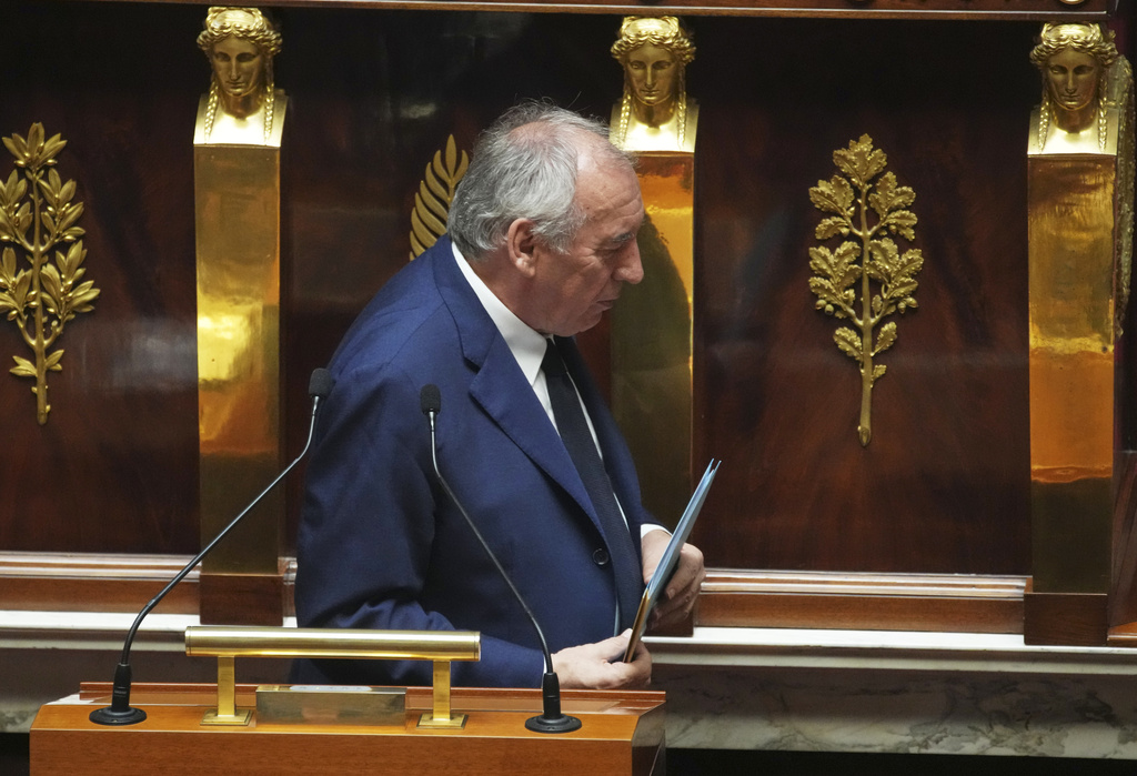 French Prime Minister Francois Bayrou leaves after addressing the National Assembly, prior to a parliamentary confidence vote that could bring him down, in paris, France, Monday, Sept. 8, 2025. (AP Photo/Christophe Ena)