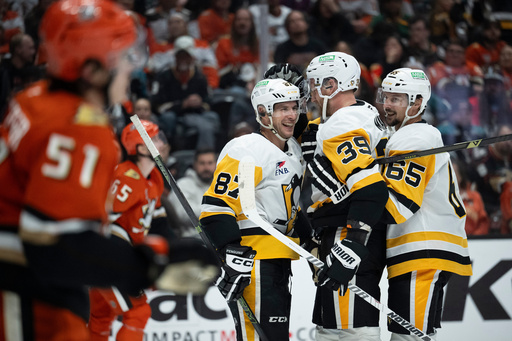 Pittsburgh Penguins right wing Anthony Mantha (39) celebrates his goal with center Sidney Crosby (87) and defenseman Erik Karlsson (65) during the second period of an NHL hockey game against the Anaheim Ducks, Tuesday, Oct. 14, 2025, in Anaheim, Calif. (AP Photo/Kyusung Gong) Pittsburgh Penguins right wing Anthony Mantha (39) celebrates his goal with center Sidney Crosby (87) and defenseman Erik Karlsson (65) during the second period of an NHL hockey game against the Anaheim Ducks, Tuesday, Oct. 14, 2025, in Anaheim, Calif. (AP Photo/Kyusung Gong)