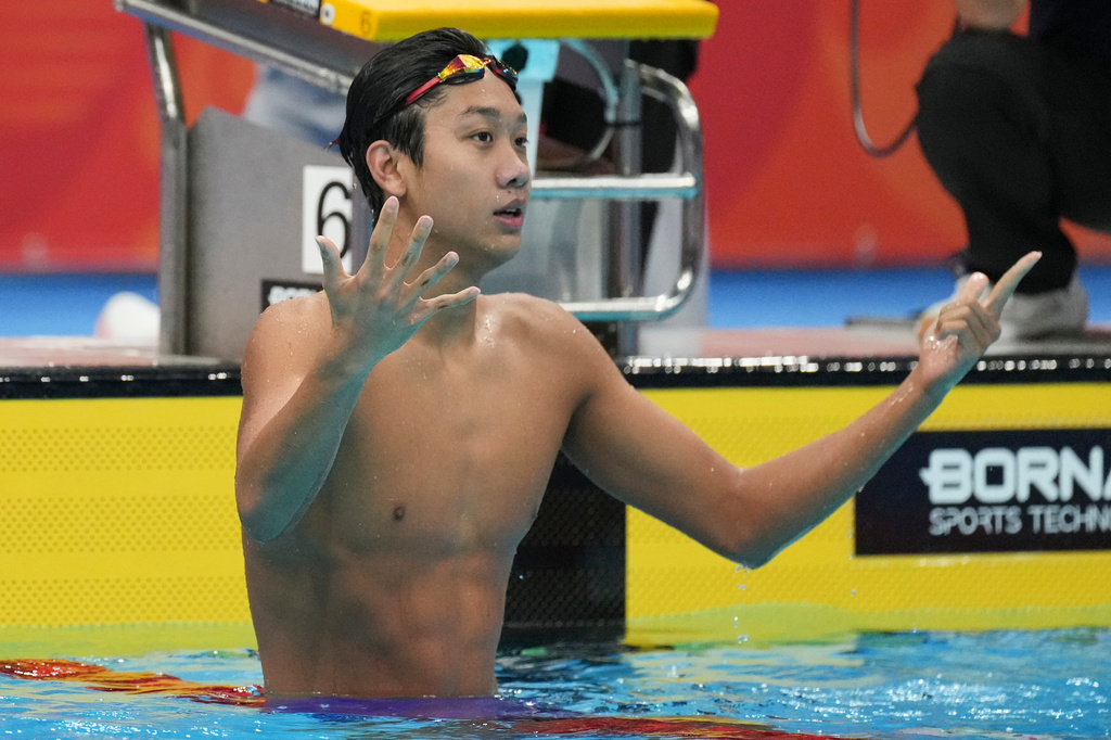 Zhang Zhanshuo of China reacts after winning the men's 400m freestyle swimming final at the Asian Games in Tokyo, Japan, Friday, Sept. 25, 2026. (AP Photo/Hiro Komae)