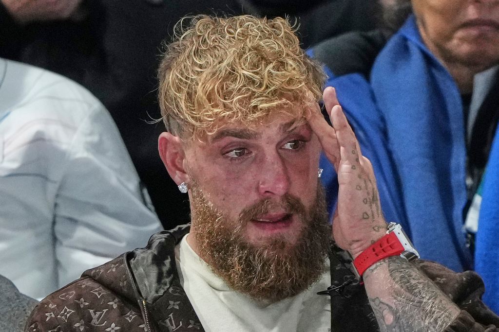 Jake Paul of the U.S. cries after his finale Jutta Leerdam of the Netherlands won the gold medal in the women's 1,000 meters speedskating race at the 2026 Winter Olympics, in Milan, Italy, Monday, Feb. 9, 2026. (AP Photo/Antonio Calanni)