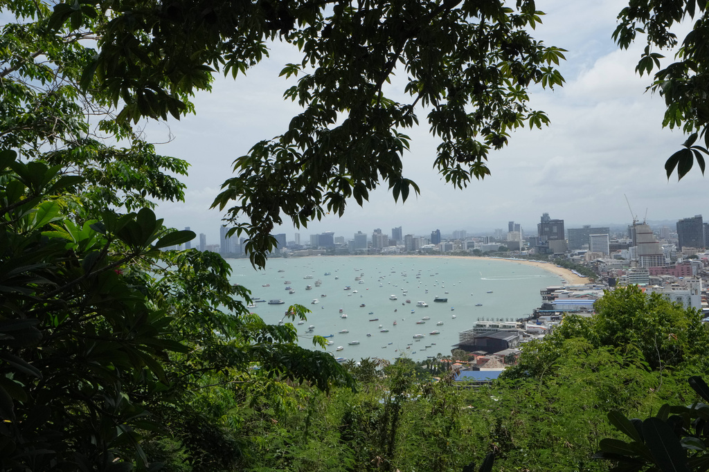 Boats float by Pattaya beach in Thailand, Tuesday, Sept. 1, 2026. (AP Photo/Sakchai Lalit)